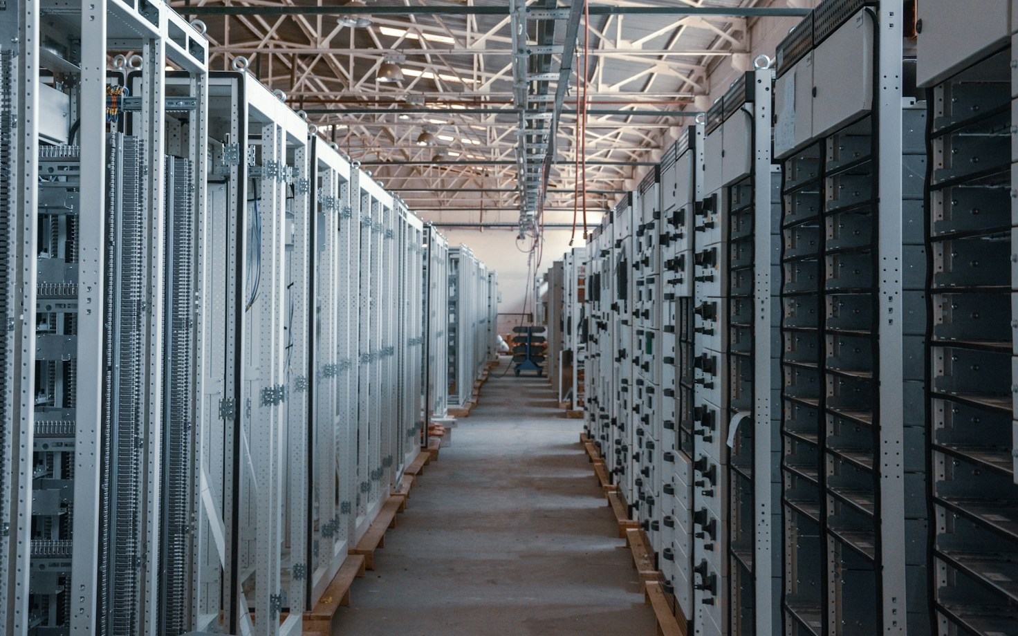 Aisle between rows of equipment racks in a data centre