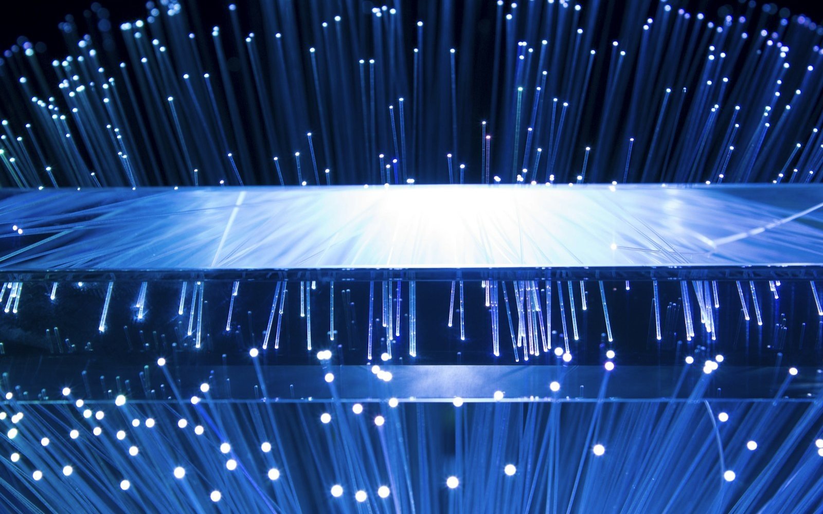Glowing strands of optical fibre