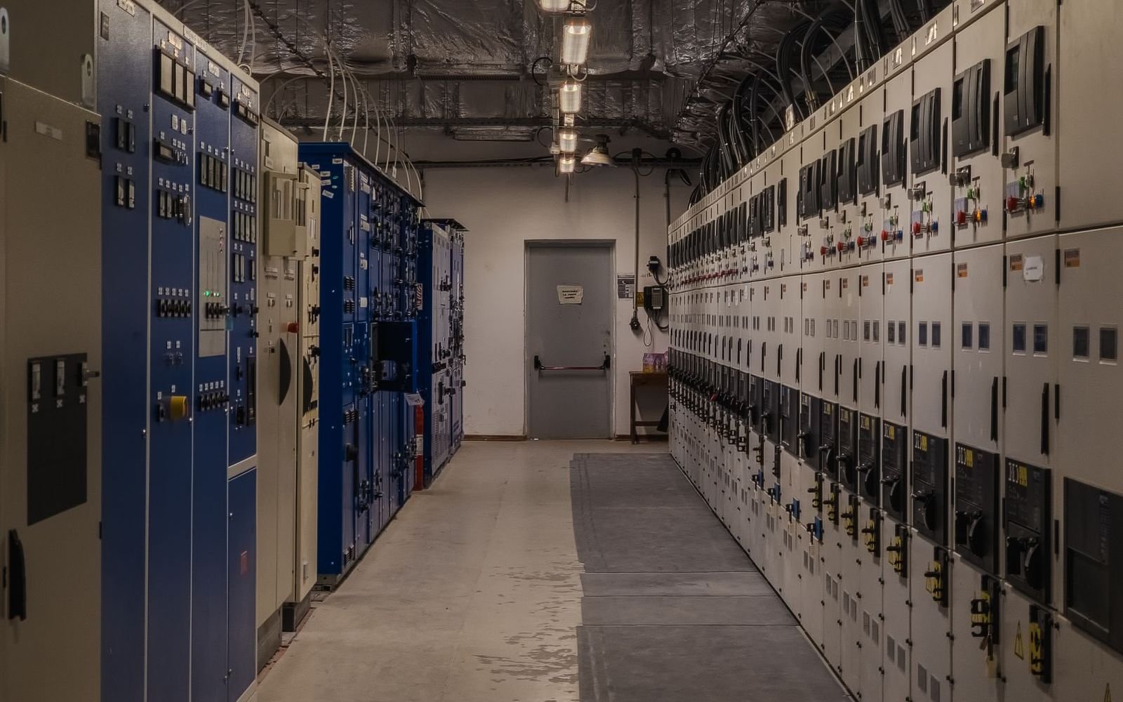 Electrical switchgear room with rows of distribution panels